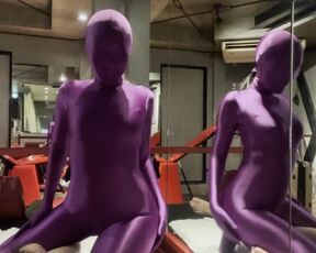 Mistress in Purple Zentai gives him Handhob to cum